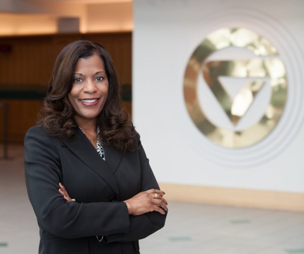 Valerie Rhodes-Sorrelle, vendor relations manager for Procurement Services, stands in front of the GV in the Student Services Building.