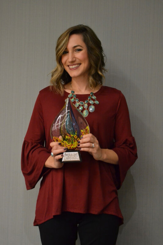 Photo of Tricia Erickson with her Teacher of the Year award