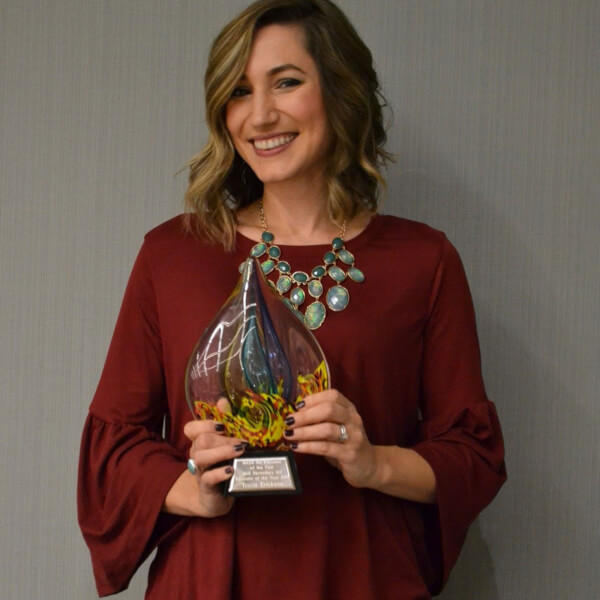 Photo of Tricia Erickson with her Teacher of the Year award