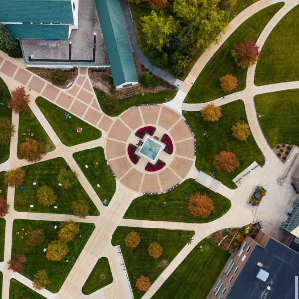 Drone photo of Allendale campus with clock tower at center and lots of sidewalks
