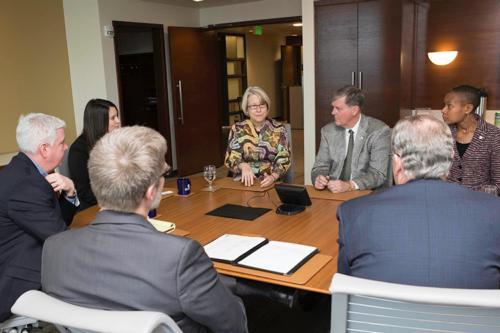 Carrie Hessler-Radelet, director of the Peace Corps, and staff members visit with President Thomas J. Haas February 6.