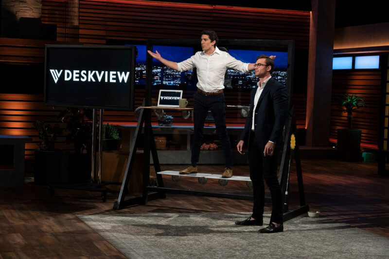 Alumnus Jason Grohowski, right,  receives an offer on the television show "Shark Tank" for a stand-up desk invention.