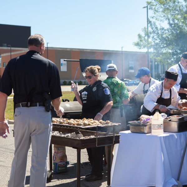 people grilling chicken 