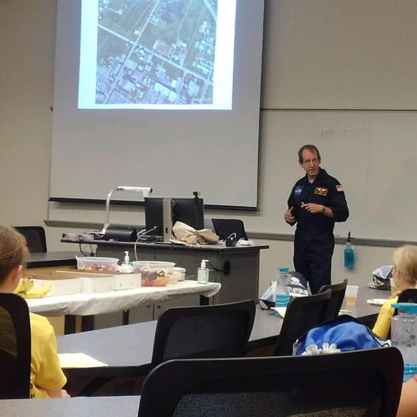 man in front of classroom