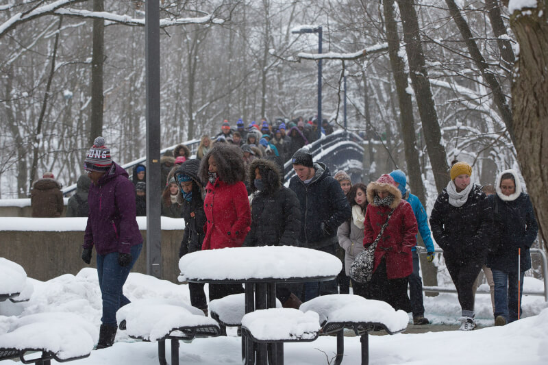 People walking across campus