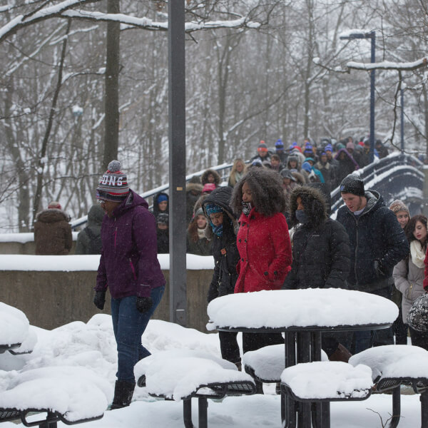 People walking across campus