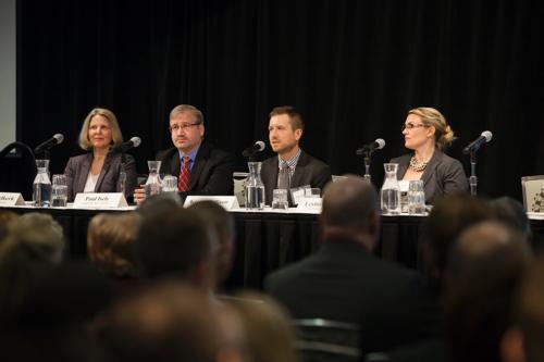 Kevin Callison speaks during the annual health summit at the Eberhard Center January 8. From left are Jean Nagelkerk, Paul Isely, Callison and Leslie Muller.