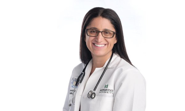 Dr. Mona Hanna-Attisha in white coat with stethoscope