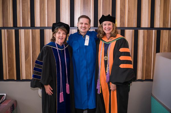 From left are Tricia Thomas, KCON dean and professor; Ben Weissenborn; and Janet Winter, KCON associate dean for undergraduate programs, at the college's recognition ceremony held August 5 on the Health Campus.