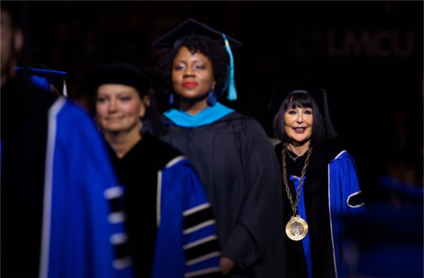 President Philomena V. Mantella enters Van Andel Arena for the Fall 2023 commencement ceremony.