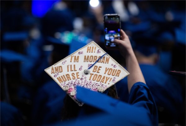 The back of a graduate&rsquo;s hat at the Fall 2023 commencement ceremony that reads &ldquo;Hi! I&rsquo;m Morgan and I&rsquo;ll be your nurse today!&rdquo;