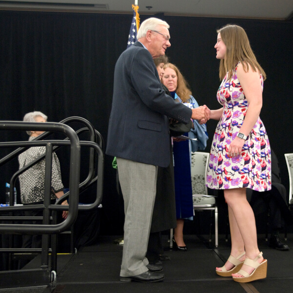 woman receiving award