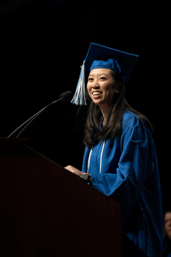 student at podium during commencement
