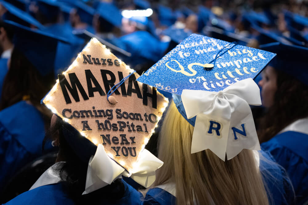 two mortar boards with messages about being a nurse