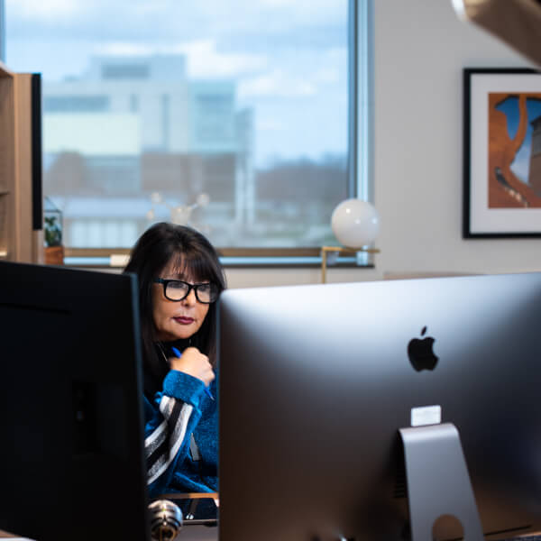 President Philomena V. Mantella leads a town hall meeting for faculty.