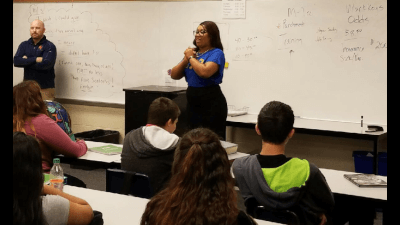 Te'Asia Martin addresses students at Kelloggsville High School.