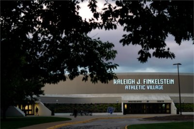 A GVSU building with the words Raleigh J. Finkelstein Athletic Village. The GV logo is also on and in front of the building.