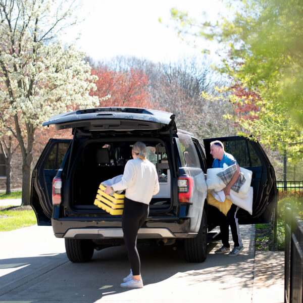 Kyra Fitzpatrick, a freshman nursing major from Batavia, Ill., loads up her belongings as she moves out of Swanson Living Center with the help of her father, Sean Fitzpatrick, on May 1, 2020. Fitzpatrick said she packed what she could back in March but wa