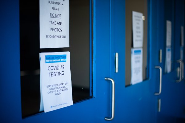 Sign on a door that says COVID-19 testing.