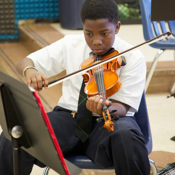 A student plays violin at Washington-Parks Academy.