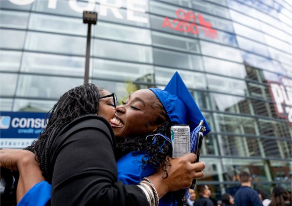 Lakeesha Dorkins, left, hugs her daughter, Destini Dorkins, after she received her degree in Human Resource Management during Saturday morning&#8217;s Commencement ceremony May 2. &#8220;Her faith is her strength,&#8221; her mother said about her daughter. &#8220;She inspires me and we are forever proud.&#8221;