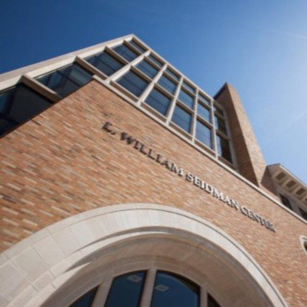 Exterior of L. William Seidman Center looking up along facade of building.