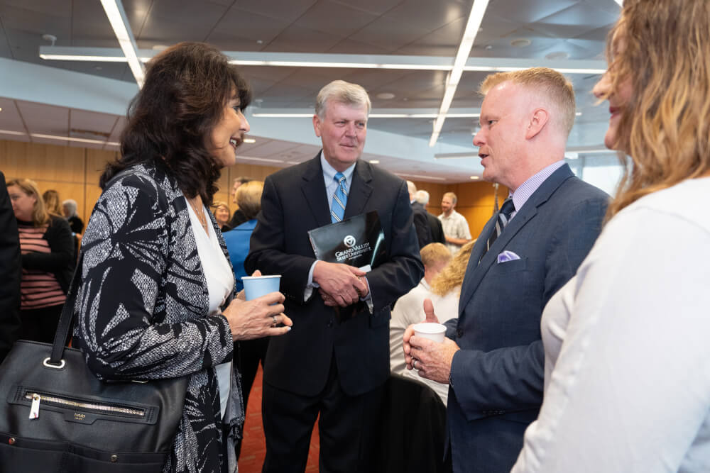 President Thomas J. Haas and President-elect Philomena Mantella with Rapid CEO Andrew Johnson.