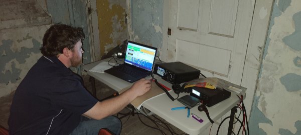 person inside lighthouse operating an amateur radio