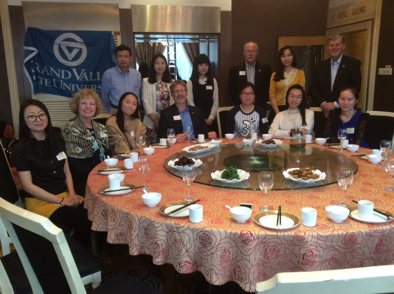 Shinian Wu, standing far left, director of the graduate program for applied linguistics, visited Xi'an International Studies University in 2016 with President Thomas J. Haas, standing far right, and others while in China for two alumni events.