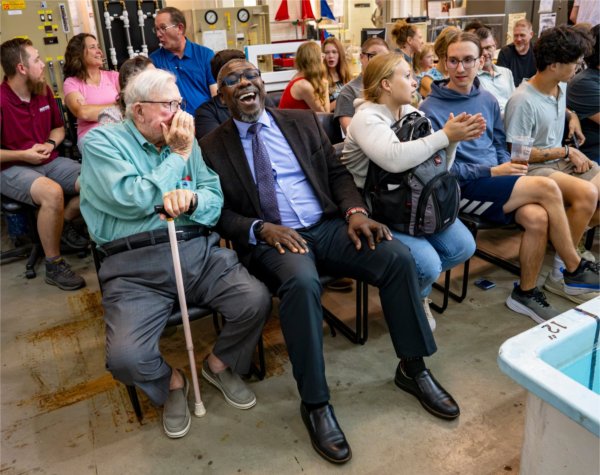 President Emeritus Arend "Don" Lubbers, left, talks with Adebayo &#8220;Bayo&#8221; Ogundipe, dean of the Padnos College of Engineering, during the Wooden Shoe Regatta August 4.