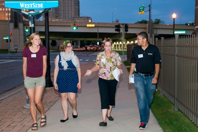 A photo of people taking a walking tour. 