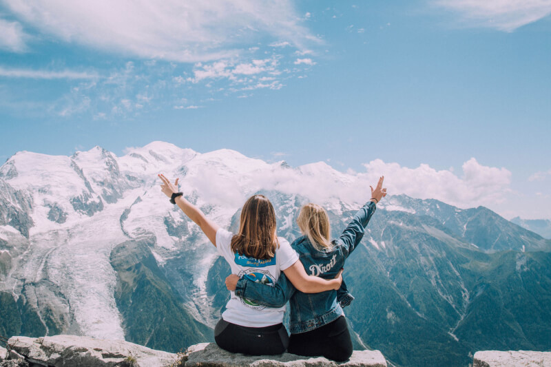 A finalist in the PIC Pics competition submitted by Valerie Wojciechowski featuring two students sitting on top of a mountain.