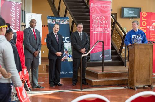 Grand Valley President Thomas J. Haas joins officials from participating institutions to announce the partnership.