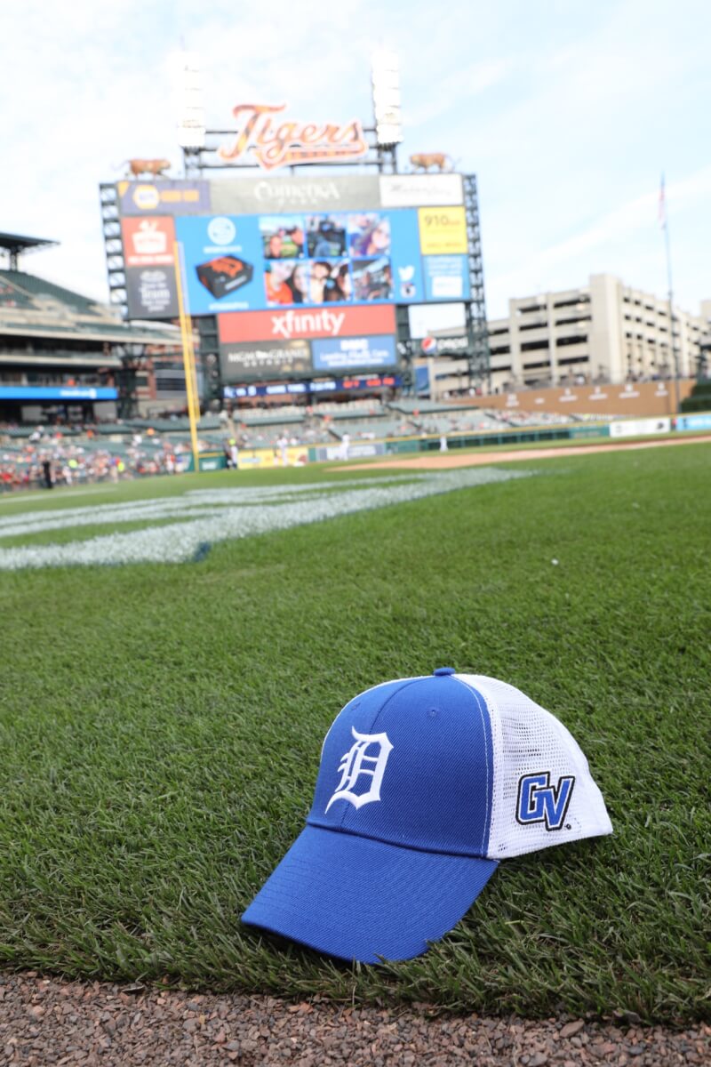 Blue Detroit Tigers and GVSU Hat on the baseball field