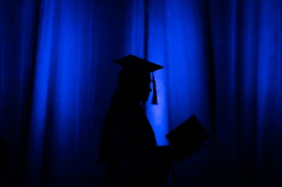 Silhouette of a graduate at the Laker Graduation Celebration