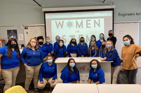 Samantha Spurr, far right, stands with West Michigan Aviation Academy students who participated in the Women in STEM Club. Spurr served as the graduate assistant at WMAA for the past three semesters.