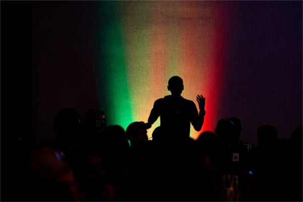 Albany State University student Zamir Cooper is silhouetted while asking a question during the Black Boys and Men National Symposium at the DoubleTree by Hilton in Battle Creek on June 10.
