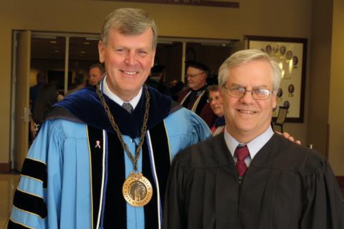 President Thomas J. Haas with Sen. Howard Walker at the Traverse City commencement ceremony.