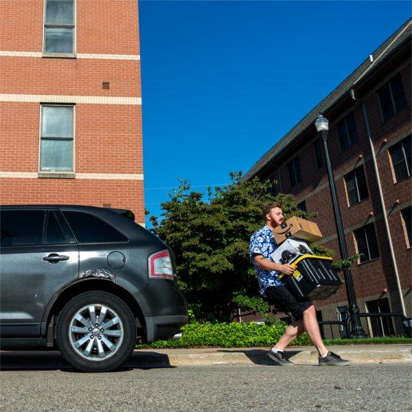 Electrical engineering major Connor Waite moves into Secchia Hall on the City Campus in downtown Grand Rapids on August 22.