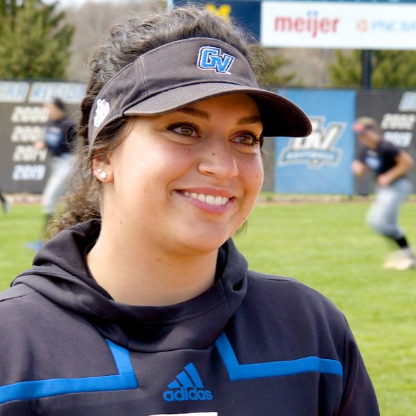 Softball player Janalee Lyke smiles for a photo.