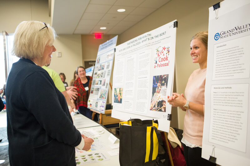 poster presentation with two women talking