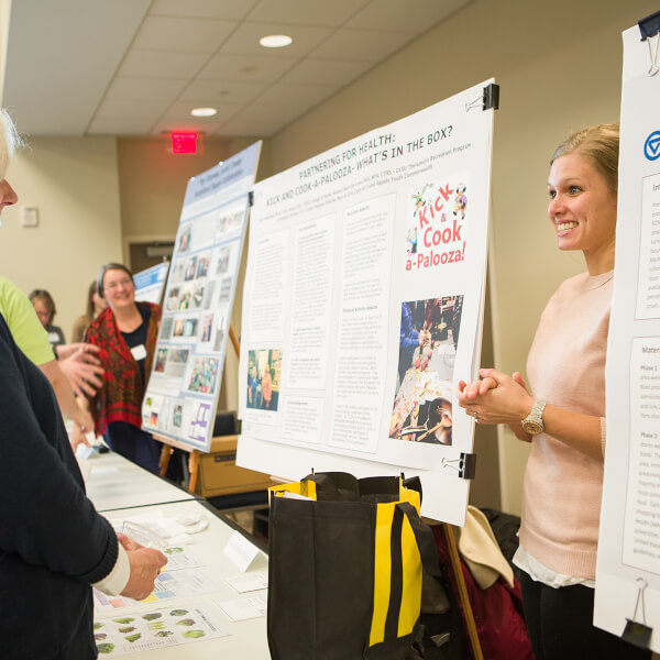 poster presentation with two women talking