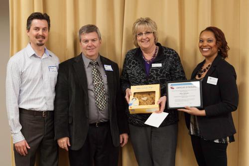From left are Brad Wallace, vice president Jim Bachmeier, Jane Johnson and Chaunte Rodgers. Johnson received the inaugural Finance and Administration Division iPIE award, and a Grand Traverse pie, for her efforts to promote inclusion and equity. 