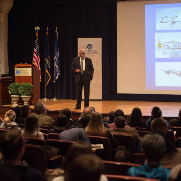 A photo of Guion Bluford giving a presentation.
