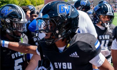 Grand Valley football players huddle up before start of game against Lincoln University