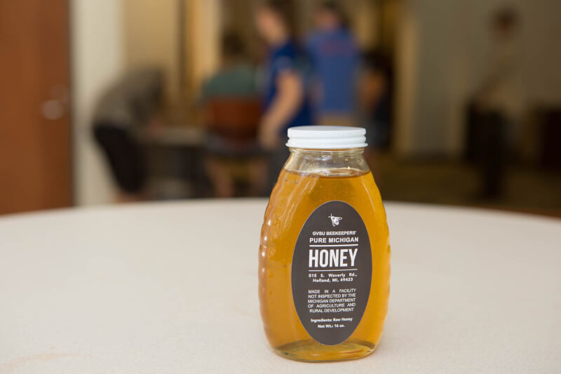 A photo of honey bottled to sell. 