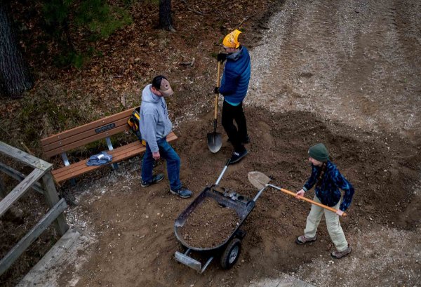 Byron Center Charter School teacher, Brandon Emmelkamp, left, Byron Center Charter School student,Tate Anderson, center, and GVSU student Kathryn Falzone, volunteered with Michigan Cares 4 Tourism at the Muskegon Luge Adventure Sports Park and Muskegon St