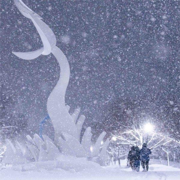 Three students walk through accumulated snow on Valley Campus during a winter storm on Jan. 19.
