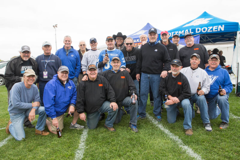 Members of the Dizmal Dozen tailgate before the October 15, 2016 homecoming game.