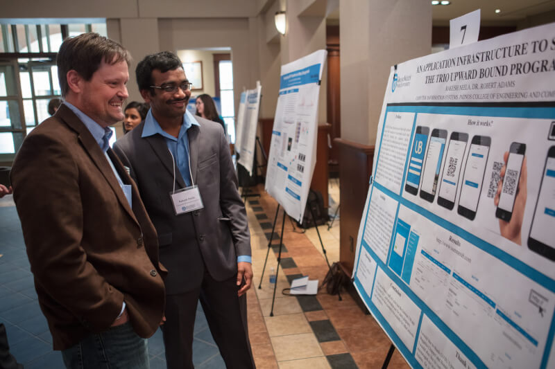 A graduate student explains his research at the 2017 Grad Showcase.